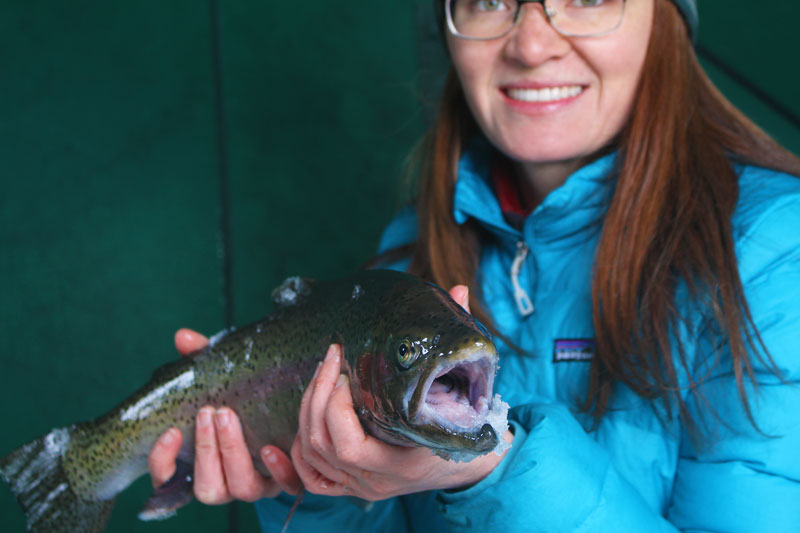 Collette with her first rainbow trout through the ice