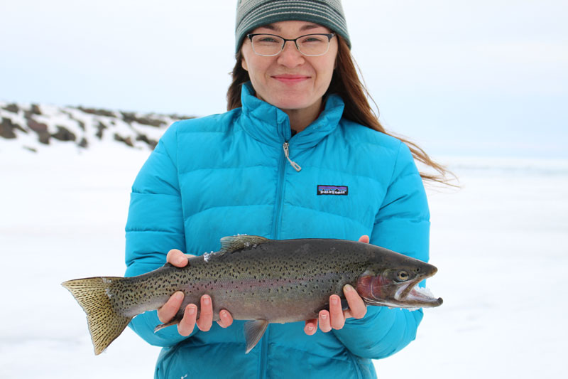 Patagonia's latest photo shoot on a frozen tundra ice fishing for rainbow trout in April.